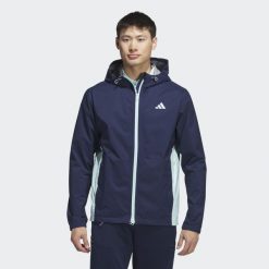 Kurtka RAIN.RDY. Niebieskie kurtki męskie ADIDAS, xs, bez wzorów, z materiału, sportowe, bez ramiączek, bez kaptura. W wyprzedaży za 450.05 zł.