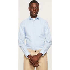 Koszula slim fit - Niebieski. Niebieskie koszule męskie marki Reserved. W wyprzedaży za 39.99 zł.