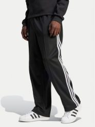 Adidas Spodnie dresowe adicolor Firebird IZ4801 Czarny Baggy Fit. Czarne spodnie dresowe męskie ADIDAS, bez wzorów, z bawełny. Za 239.99 zł.