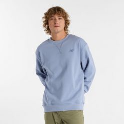 Bluza męska New Balance MT41506DUS – niebieska. Niebieskie bluzy nierozpinane męskie New Balance, m, z aplikacjami, z bawełny, klasyczne, bez ramiączek, bez kaptura. Za 249.99 zł.