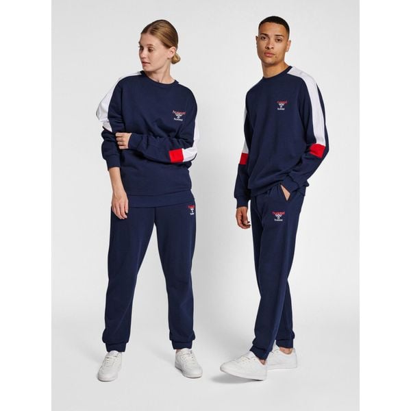 Jogging Hummel IC Dayton. Niebieskie spodnie dresowe męskie HUMMEL, bez wzorów, z dresówki. Za 244.50 zł.