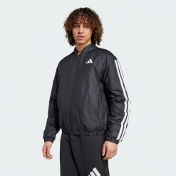 Kurtka Essentials 3-Stripes Insulated Bomber. Czarne kurtki męskie ADIDAS, l, bez wzorów, z materiału, bez ramiączek, bez kaptura. W wyprzedaży za 300.50 zł.