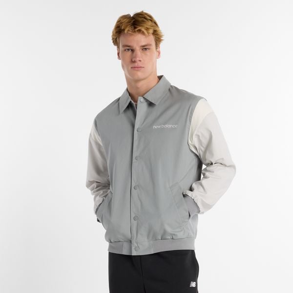 Kurtka męska New Balance MO51507YST – szara. Szare kurtki męskie New Balance, m, bez wzorów, z bawełny, klasyczne, bez ramiączek, bez kaptura. Za 399.99 zł.