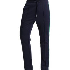 Calvin Klein Jeans SIDE STRIPE TRACK PANTS Spodnie treningowe dark blue. Długie spodnie sportowe męskie marki Calvin Klein Jeans. Za 549.00 zł.