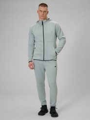 4F Spodnie treningowe szybkoschnące męskie - miętowe M. Niebieskie długie spodnie sportowe męskie 4f, bez wzorów, z materiału. Za 199.99 zł.