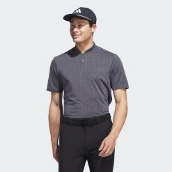Koszulka Ultimate365 Printed Polo. Czarne koszulki polo męskie ADIDAS, m, bez wzorów, z materiału, sportowe, bez kołnierzyka, bez ramiączek. W wyprzedaży za 144.60 zł.