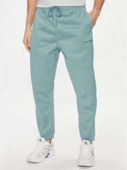 Calvin Klein Performance Spodnie dresowe 00GMF3P613 Niebieski Regular Fit. Niebieskie spodnie dresowe męskie Calvin Klein Performance, bez wzorów, z dresówki. Za 519.99 zł.