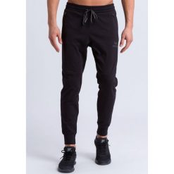 Spodnie dresowe Erima essential. Czarne spodnie dresowe męskie Erima, bez wzorów, z dresówki. Za 195.00 zł.