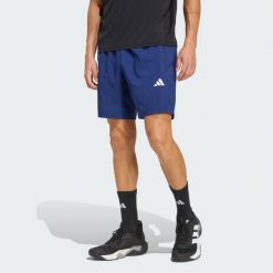 Tkane Szorty Do Ćwiczeń Essentials Base. Niebieskie szorty sportowe męskie ADIDAS, bez wzorów, sportowe. Za 119.00 zł.