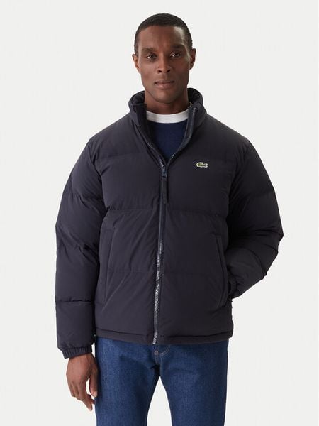Lacoste Kurtka puchowa BH5154 Granatowy Regular Fit. Niebieskie kurtki męskie Lacoste, m, bez wzorów, z puchu, bez ramiączek, bez kaptura. Za 939.00 zł.