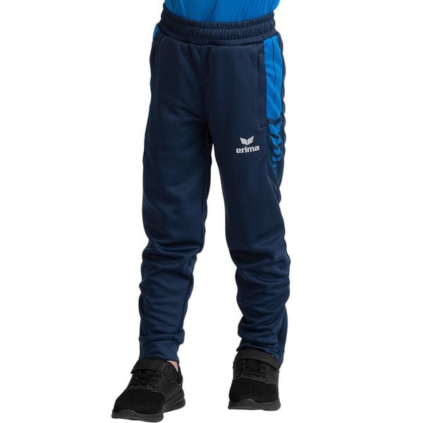 Spodnie robocze Erima Six Wings Niebieskie Junior. Niebieskie spodnie dresowe męskie Erima, bez wzorów, z materiału, sportowe. Za 252.99 zł.