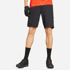 Szorty rowerowe MTB Rockrider Cargo. Czarne szorty sportowe męskie ROCKRIDER, bez wzorów, z materiału, sportowe. Za 179.99 zł.