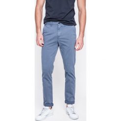 Calvin Klein Jeans - Jeansy. Szare spodnie na co dzień męskie marki Calvin Klein Jeans, z bawełny, casualowe. W wyprzedaży za 269.90 zł.