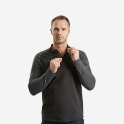 Koszulka turystyczna męska z długim rękawem Quechua SH100 Warm. Czarne koszulki męskie z długim rękawem QUECHUA, m, bez wzorów, z elastanu, sportowe, bez kołnierzyka, bez ramiączek. Za 59.99 zł.