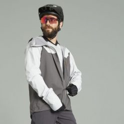 Kurtka przeciwdeszczowa rowerowa Rockrider MTB All Mountain. Brązowe kurtki treningowe męskie ROCKRIDER, l, bez wzorów, z materiału, bez kaptura, rowerowe. Za 409.99 zł.