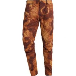 GStar PHARRELL WILLIAMS ELWOOD X52 3D Spodnie materiałowe rustic brown/mandarin. Spodnie na co dzień męskie marki G-Star. Za 559.00 zł.