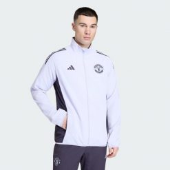 Kurtka reprezentacyjna Manchester United Tiro 25 Competition. Czarne kurtki męskie ADIDAS, bez wzorów, sportowe, bez ramiączek, bez kaptura. Za 369.00 zł.