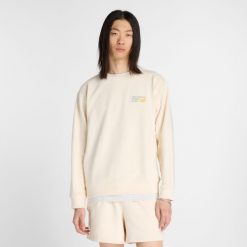 Bluza męska New Balance MT41547PEF – beżowa. Brązowe bluzy nierozpinane męskie New Balance, m, bez wzorów, z bawełny, klasyczne, bez ramiączek, bez kaptura. Za 359.99 zł.