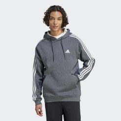 Bluza męska adidas Essentials Fleece 3-Stripes Hoodie. Szare bluzy z kapturem męskie ADIDAS, m, bez wzorów, z materiału, sportowe, bez ramiączek, z kapturem. Za 159.99 zł.