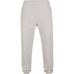 Spodnie dresowe Urban Classics. Białe spodnie dresowe męskie Urban Classics, bez wzorów, z bawełny. Za 267.50 zł.