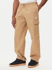 Adidas Spodnie dresowe Trefoil Essentials JX3912 Beżowy Loose Fit. Brązowe spodnie dresowe męskie ADIDAS, bez wzorów, z bawełny. Za 249.99 zł.