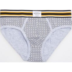 Slipy - Żółty. Bez kategorii marki Reserved. Za 29.99 zł.