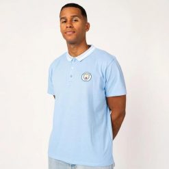 Polo męskie Manchester City. Niebieskie koszulki polo męskie MANCHESTER CITY, m, z aplikacjami, sportowe, bez kołnierzyka, bez ramiączek. Za 184.99 zł.