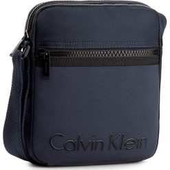 Saszetka CALVIN KLEIN - Alec Reporter K50K503186 422. Saszetki męskie marki Calvin Klein. W wyprzedaży za 259.00 zł.