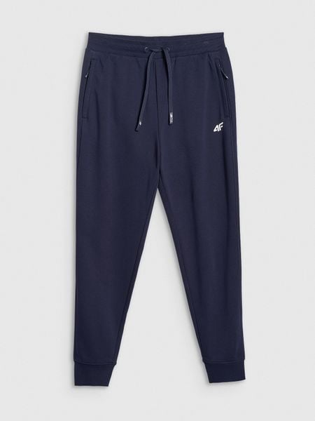 4F Spodnie dresowe joggery męskie - granatowe M. Niebieskie spodnie dresowe męskie 4f, bez wzorów, z dresówki. Za 149.99 zł.