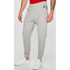 Reebok - Spodnie. Szare spodnie dresowe męskie Reebok, z bawełny. W wyprzedaży za 249.90 zł.