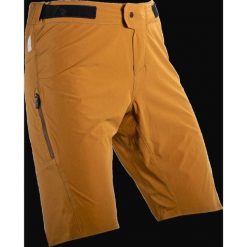 Spodenki rowerowe (+spodenki kolarskie z pampersem w zestawie) LEATT Shorts MTB. Brązowe szorty sportowe męskie LEATT, bez wzorów, sportowe. W wyprzedaży za 314.10 zł.
