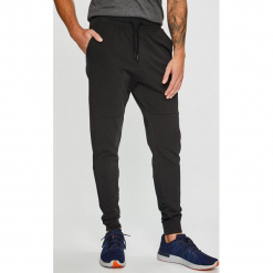 Under Armour - Spodnie Terry. Szare długie spodnie sportowe męskie marki Under Armour, z bawełny. W wyprzedaży za 199.90 zł.