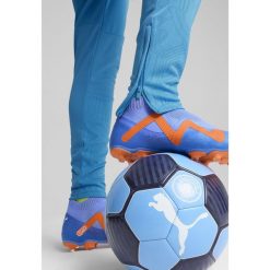 Męskie spodnie treningowe Manchester City PUMA Magic Blue Yellow Glow. Niebieskie długie spodnie sportowe męskie Puma, bez wzorów, do piłki nożnej. W wyprzedaży za 251.20 zł.
