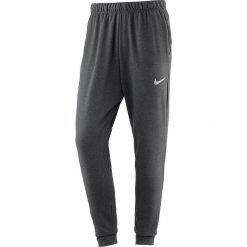 Spodnie sportowe "Dry" w kolorze ciemnoszarym. Długie spodnie sportowe męskie marki Nike Performance. W wyprzedaży za 128.95 zł.