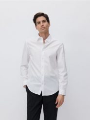 Bawełniana koszula slim fit - biały. Białe koszule męskie Reserved, l, bez wzorów, z bawełny, bez kołnierzyka, bez ramiączek. W wyprzedaży za 99.99 zł.