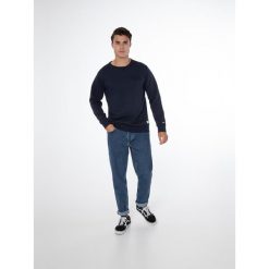 Bluza męska Protest NXGBAYRN sweatshirt. Niebieskie bluzy nierozpinane męskie Protest, m, bez wzorów, bez ramiączek, bez kaptura. W wyprzedaży za 121.50 zł.