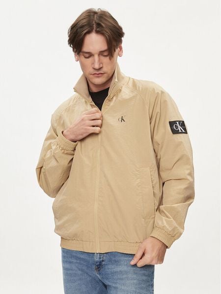 Calvin Klein Jeans Kurtka przejściowa Harrington J30J325102 Beżowy Regular Fit. Brązowe kurtki męskie Calvin Klein Jeans, m, bez wzorów, z jeansu, bez ramiączek, bez kaptura. Za 369.99 zł.