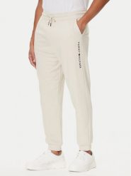 Tommy Hilfiger Spodnie dresowe UM0UM03664 Écru Regular Fit. Spodnie dresowe męskie Tommy Hilfiger, bez wzorów, z bawełny. Za 249.99 zł.