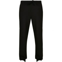 Spodnie joggingowe Urban Classics zwężane. Czarne spodnie dresowe męskie Urban Classics, bez wzorów, z dresówki. Za 237.00 zł.
