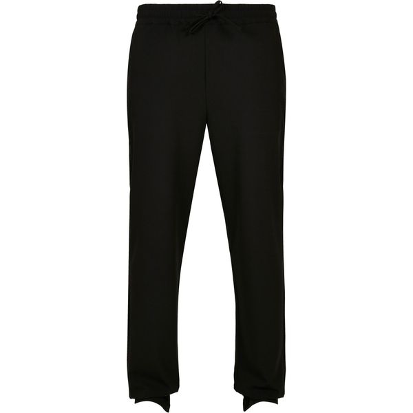 Spodnie joggingowe Urban Classics zwężane. Czarne spodnie dresowe męskie Urban Classics, bez wzorów, z dresówki, casualowe, długie. Za 224.00 zł.
