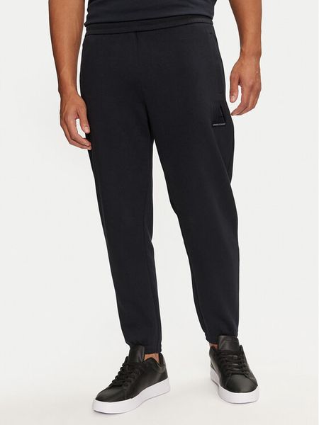 Armani Exchange Spodnie dresowe 6DZPJA ZJNKZ 1510 Granatowy Regular Fit. Niebieskie spodnie dresowe męskie Armani Exchange, bez wzorów, z bawełny. Za 529.99 zł.