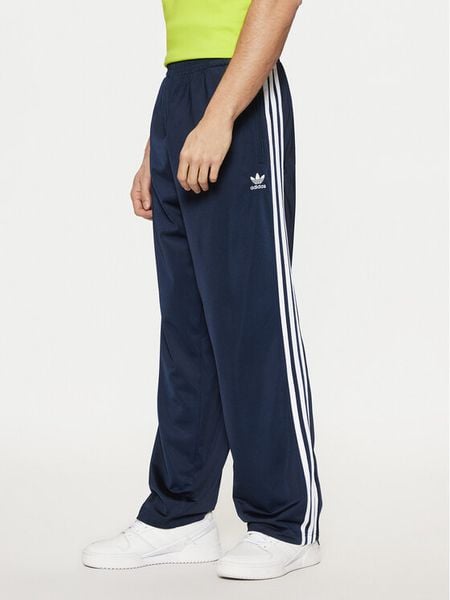 Adidas Spodnie dresowe adicolor Classics Firebird IM9471 Granatowy Regular Fit. Niebieskie spodnie dresowe męskie ADIDAS, bez wzorów, z dresówki. Za 179.99 zł.
