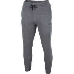Spodnie dresowe męskie SPMD001 - ciemny szary melanż. Spodnie dresowe męskie marki 4f. Za 119.99 zł.