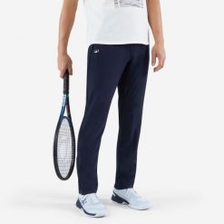 Spodnie tenisowe męskie Artengo Essential. Niebieskie eleganckie spodnie męskie KUIKMA, bez wzorów, z elastanu, eleganckie. Za 79.99 zł.