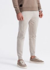 Ombre Spodnie męskie dresowe typu jogger - jasnobeżowe V1 OM-PABS-0173 XL. Brązowe długie spodnie sportowe męskie Ombre, bez wzorów, z dresówki. Za 89.99 zł.