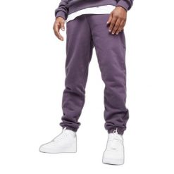 Spodnie dresowe Urban Classics Ultra Heavy. Fioletowe spodnie dresowe męskie Urban Classics, bez wzorów, z bawełny. Za 267.50 zł.