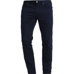 Banana Republic SLIM TRAVELER PANT Spodnie materiałowe navy. Niebieskie spodnie na co dzień męskie Banana Republic, z bawełny. Za 359.00 zł.