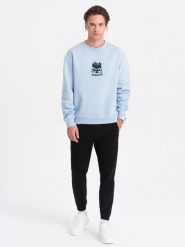 Spodnie męskie dresowe CARROT ze strukturalnej dzianiny - czarne V8 - Rozmiar: L. Czarne spodnie dresowe męskie Ombre Clothing, bez wzorów, z bawełny. W wyprzedaży za 69.99 zł.
