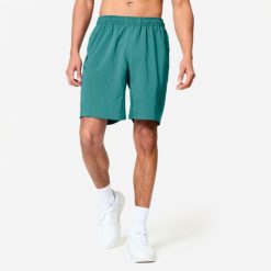 Spodenki fitness cardio męskie Domyos. Niebieskie szorty sportowe męskie DOMYOS, bez wzorów, z elastanu, sportowe. Za 49.99 zł.