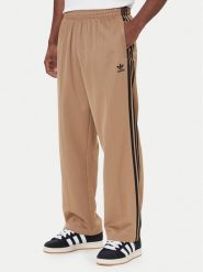 Adidas Spodnie dresowe adicolor Firebird JY1419 Beżowy Baggy Fit. Brązowe spodnie dresowe męskie ADIDAS, bez wzorów, z bawełny. Za 329.99 zł.
